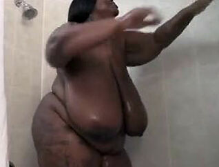 This Gigantic ebony gal jerks in the shower. Her humungous